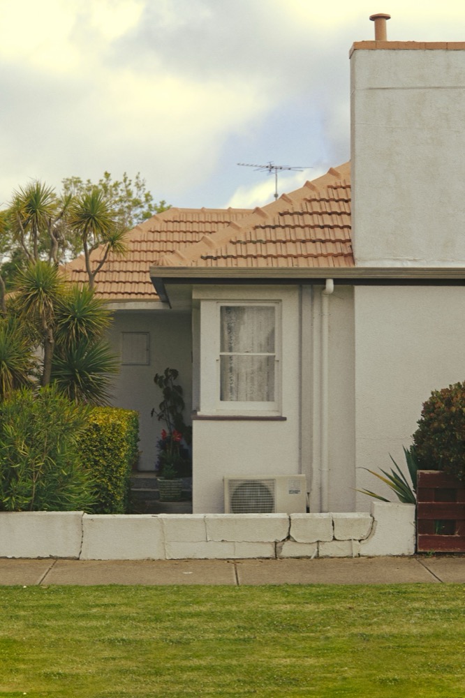 A newly built detached Australian home at dusk.